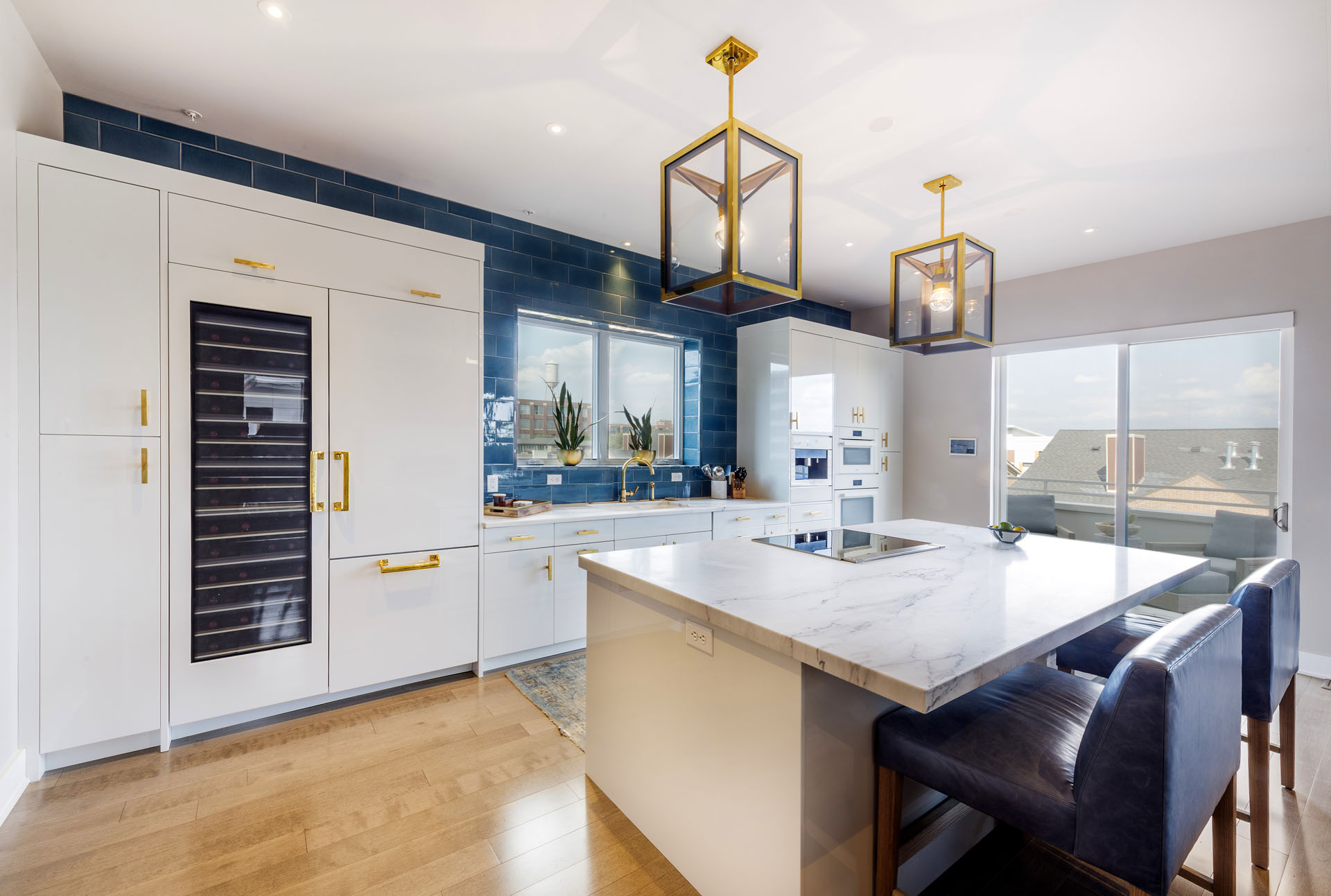 Contemporary penthouse kitchen in a gloss white finish, built by Trillium