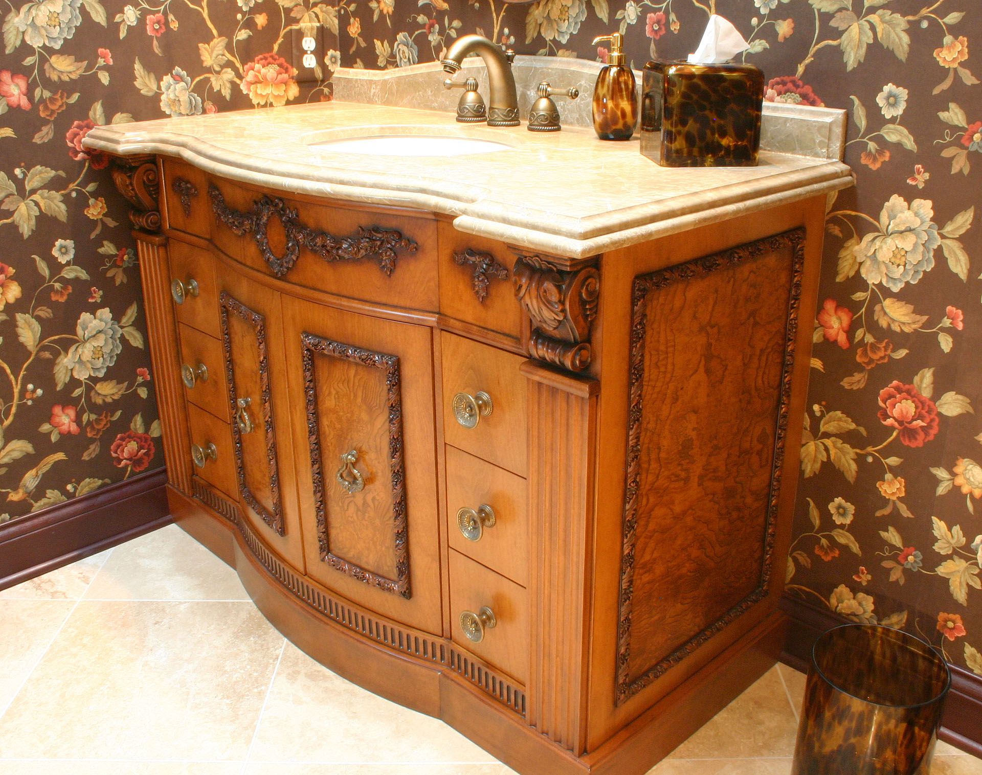 Bow-front bath vanity with olive ash burl panels, built by Trillium for the West Park project