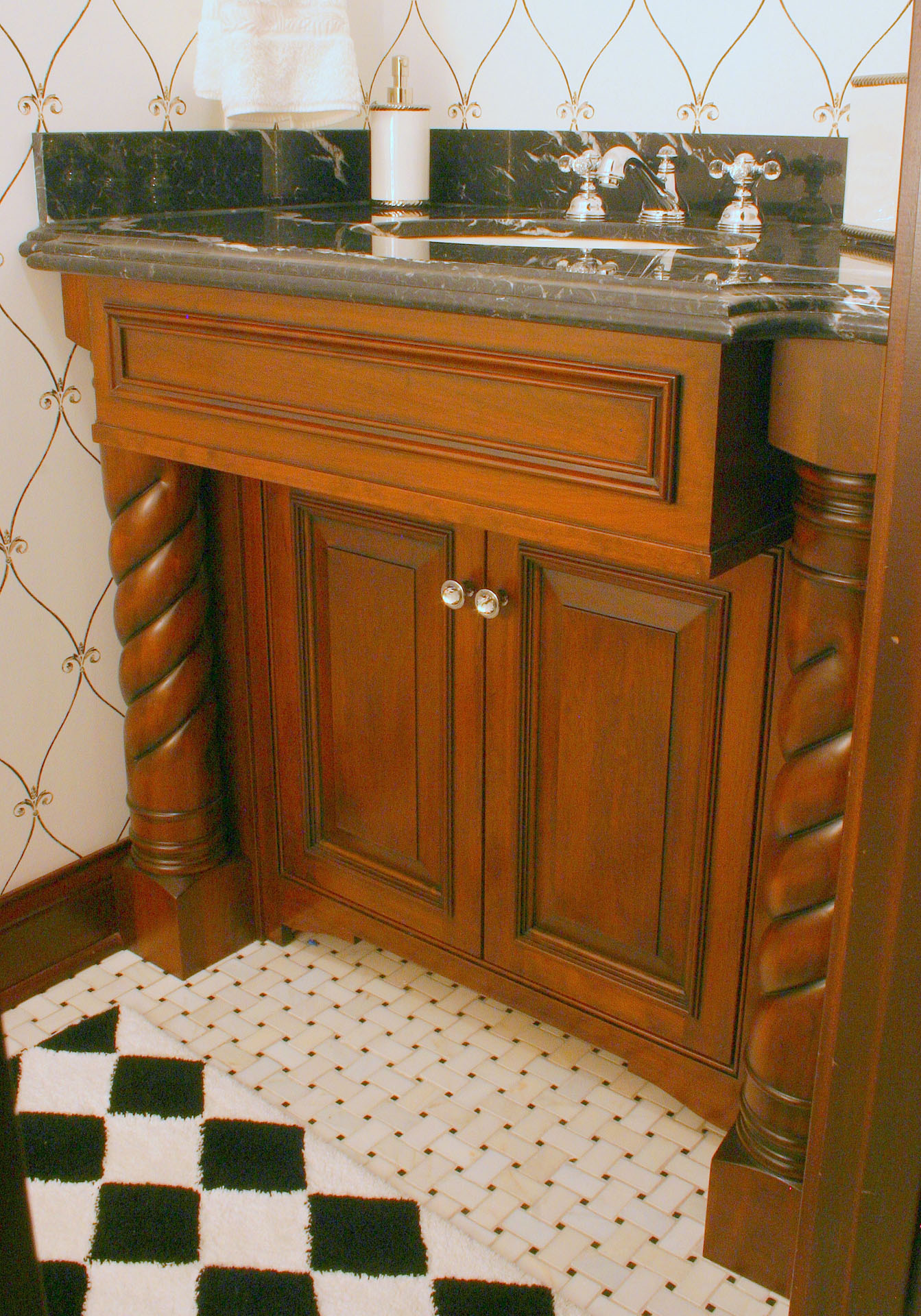 Cherry bath vanity with hand-turned rope detailing, built by Trillium for the West Park project