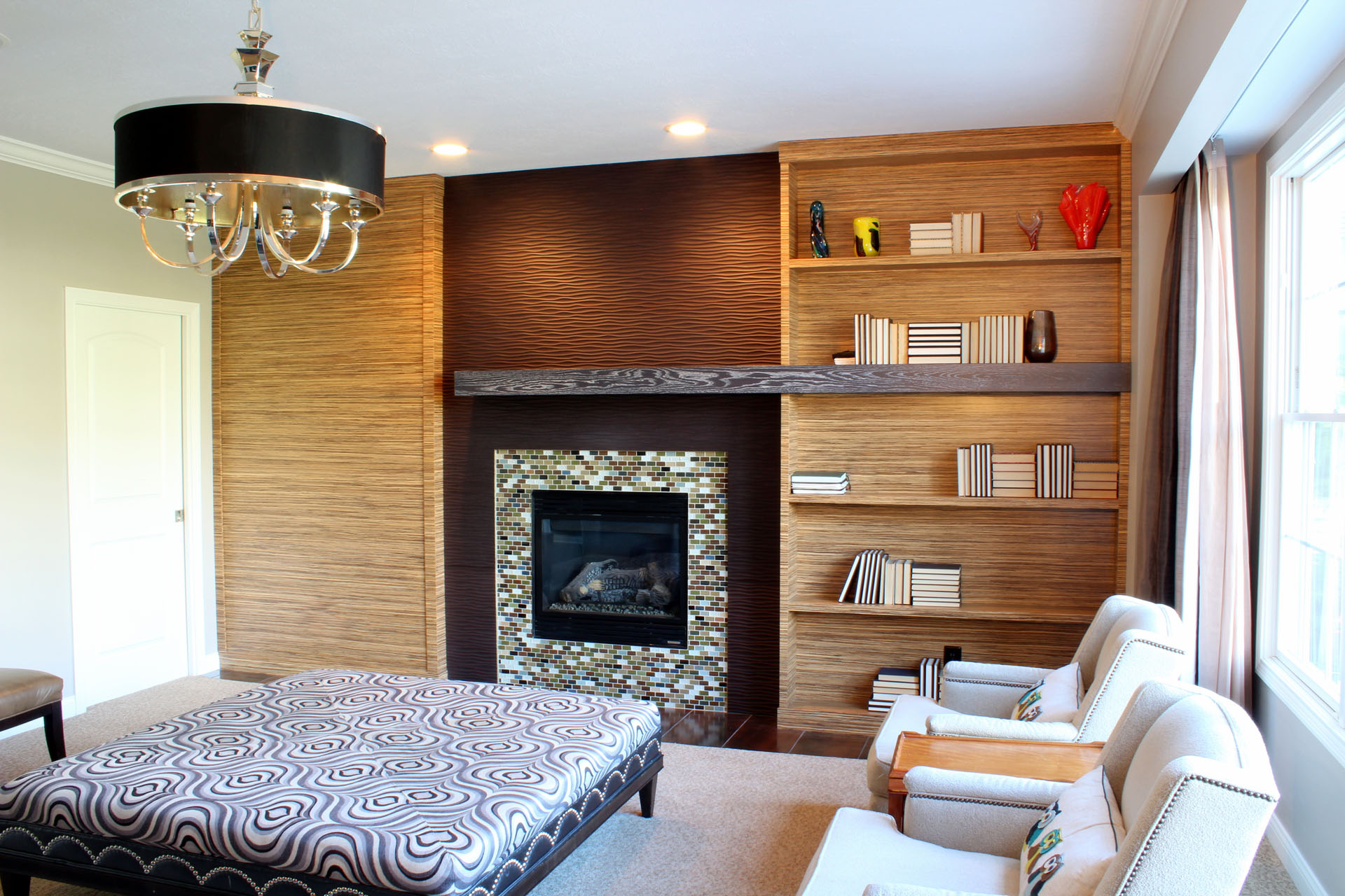 Zebrawood fireplace cabinetry, built by Trillium for the Westside project