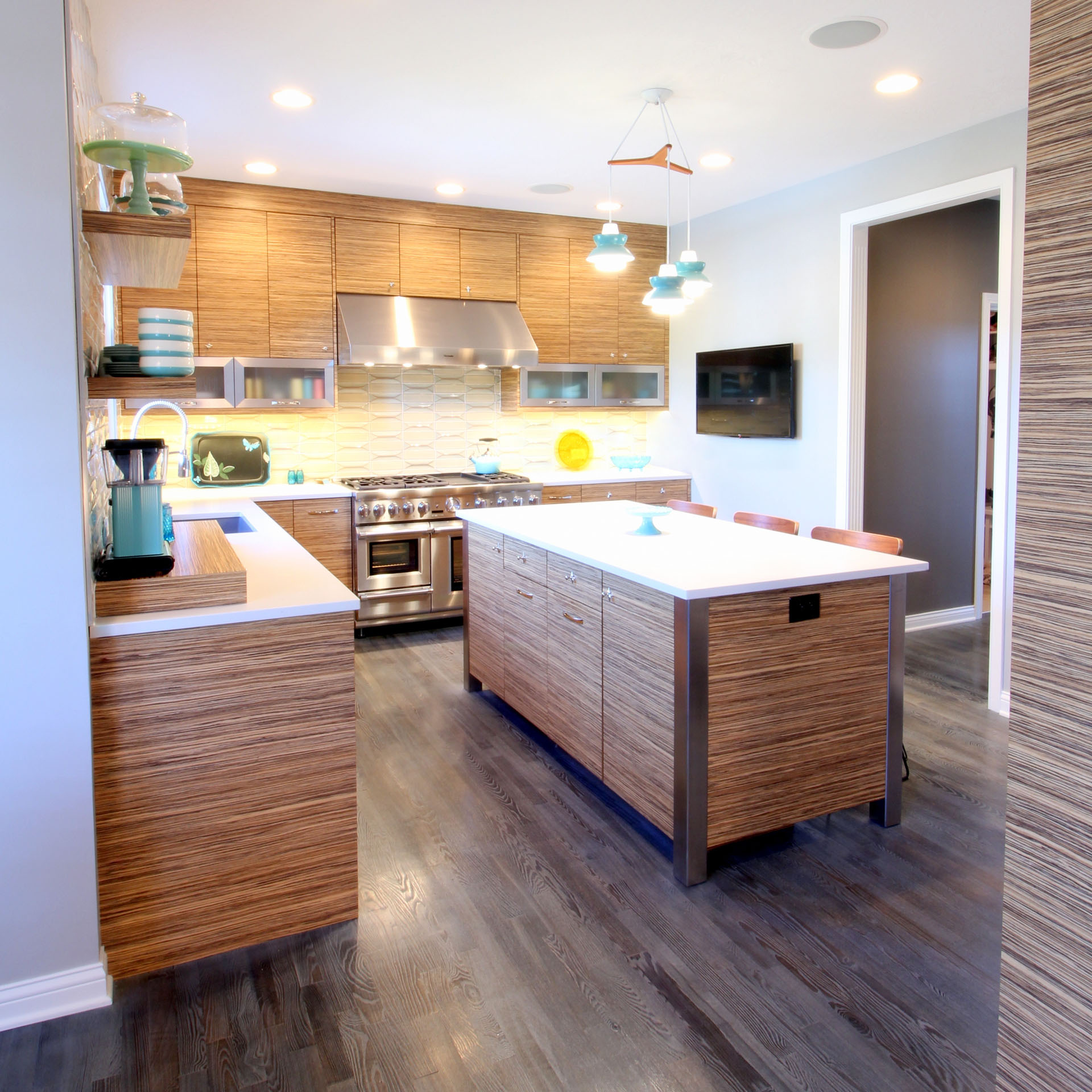 Contemporary zebrawood kitchen cabinetry, built by Trillium for the Westside project